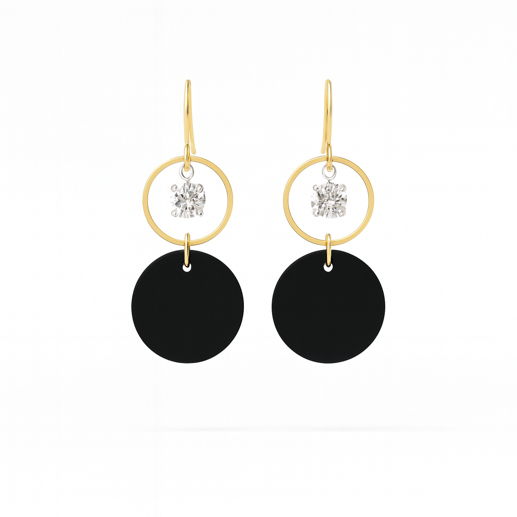 A pair of black leather statement earrings featuring gold-plated rings and crystal details on a white background.