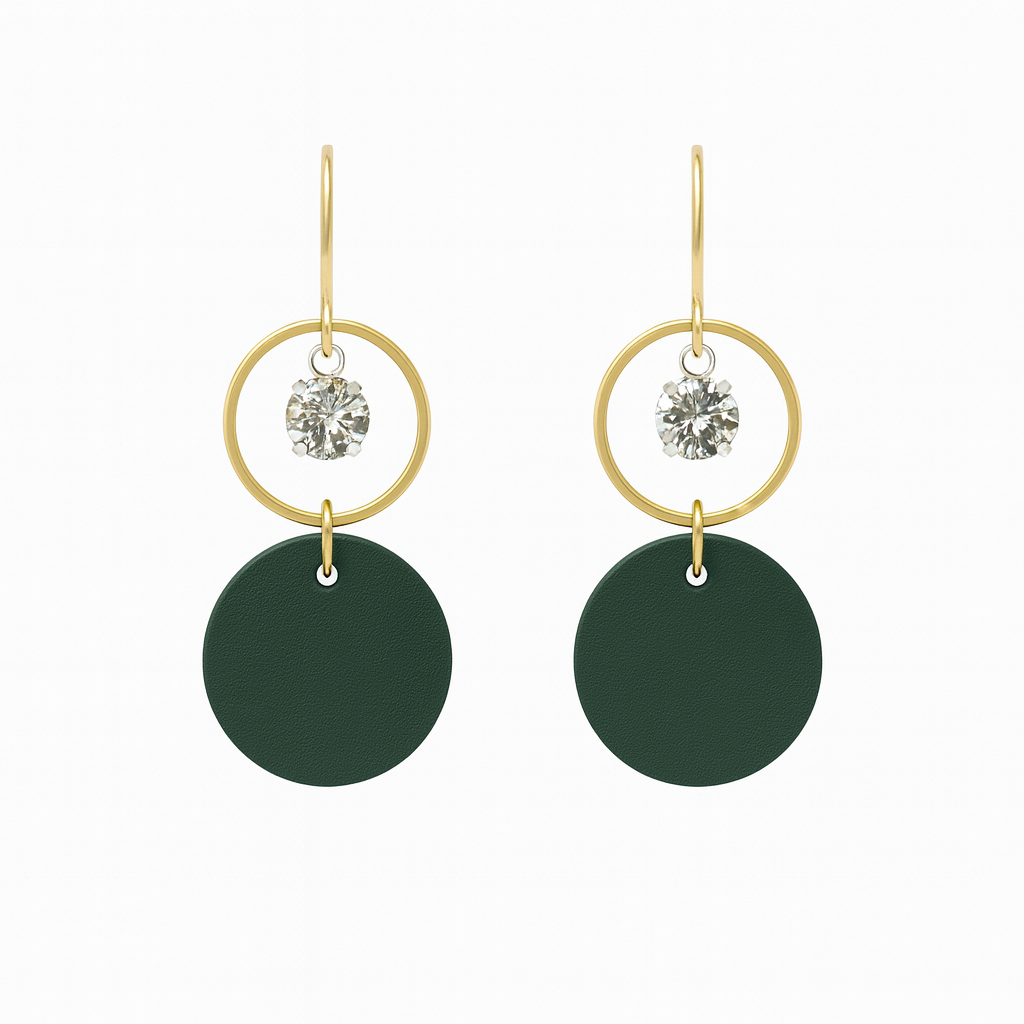 A pair of green leather statement earrings featuring gold-plated rings and crystal details on a white background.