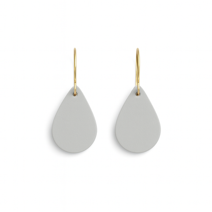 A pair of light gray leather teardrop earrings with gold-plated stainless steel hooks on a white background.