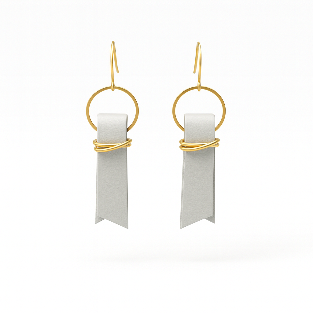 A pair of light gray leather ribbon earrings accented with gold-plated wire and rings on a white background.