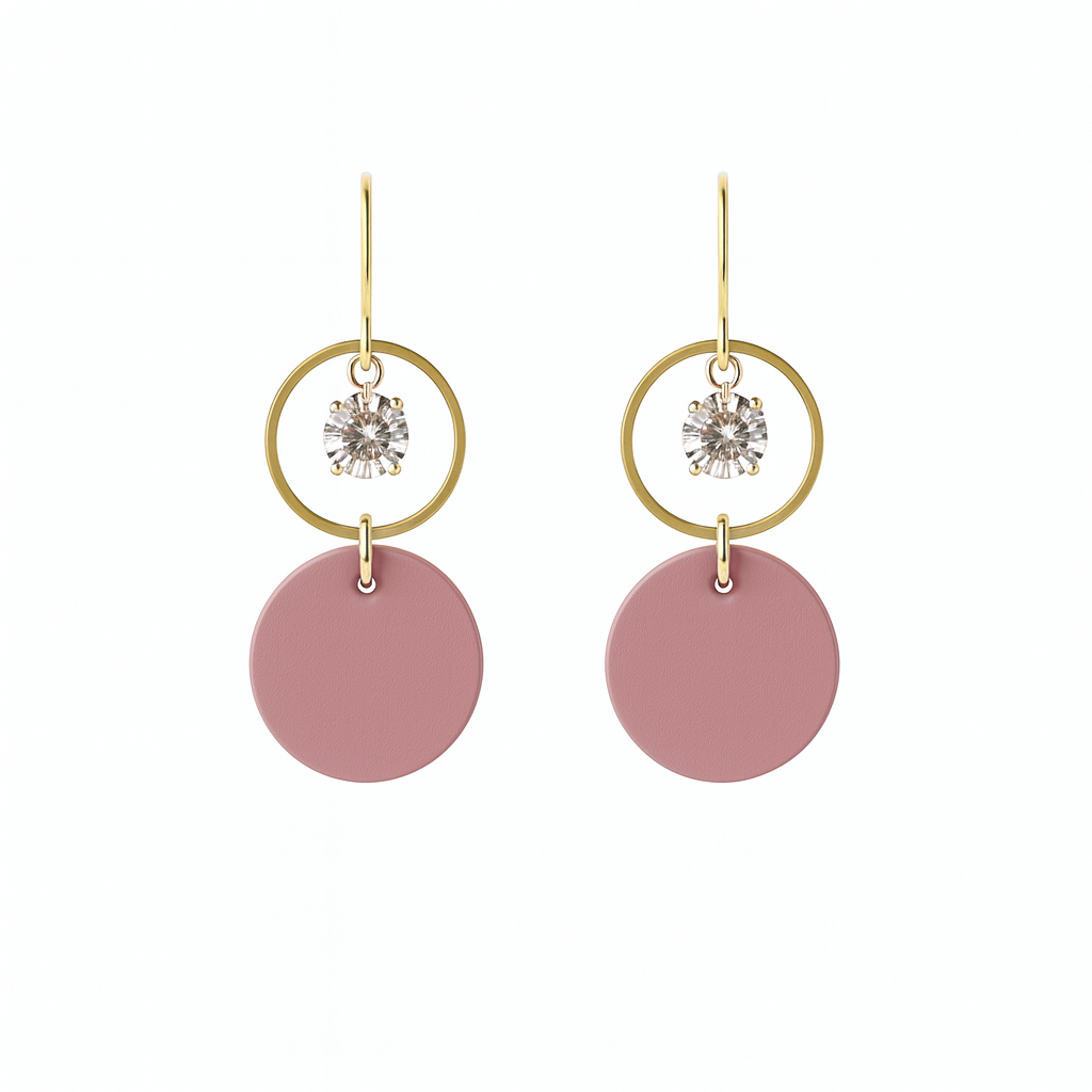 A pair of mauve leather statement earrings featuring gold-plated rings and crystal details on a white background.