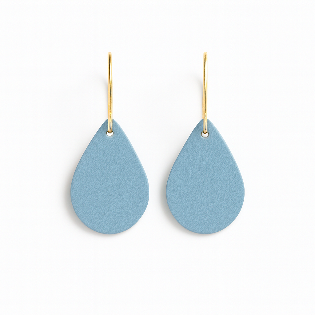 Pair of blue leather teardrop earrings with gold-plated stainless steel hooks on a white background.