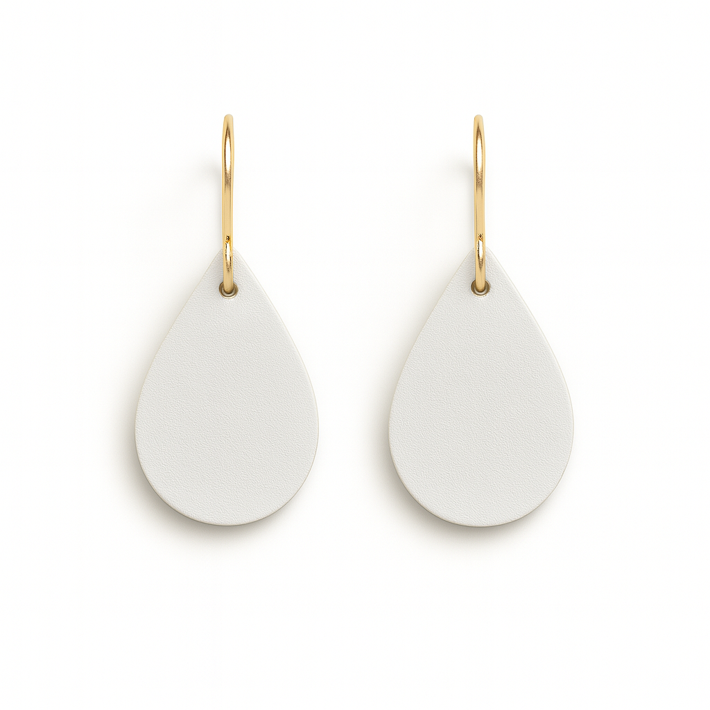 A pair of off-white teardrop earrings with gold-plated stainless steel hooks on a white background.