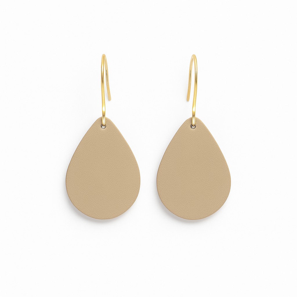 A pair of beige leather teardrop earrings with gold-plated stainless steel hooks on a white background.