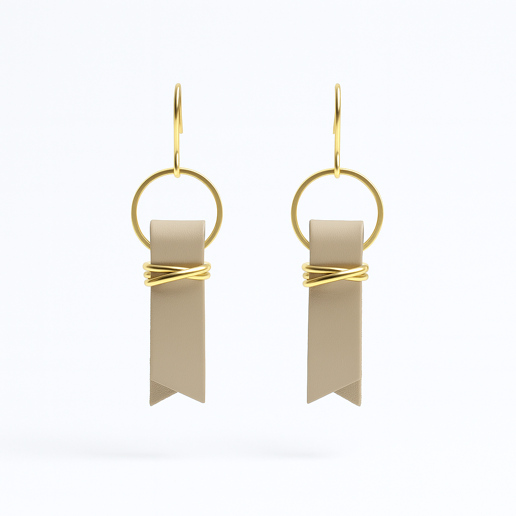 Beige leather ribbon earrings accented with gold-plated wire and rings on  a white background.