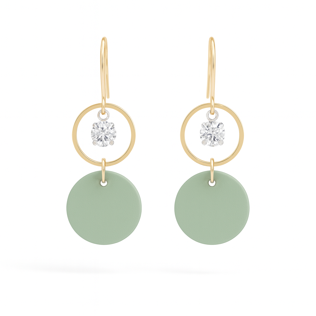 Seafoam green leather statement earrings featuring gold-plated rings and crystal details on a white background.