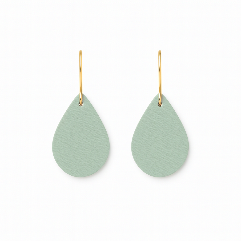 A pair of seafoam green teardrop earrings with gold-plated stainless steel hooks on a white background.