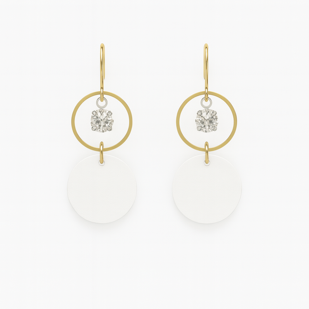 White leather statement earrings featuring gold-plated rings and crystal details on a white background.