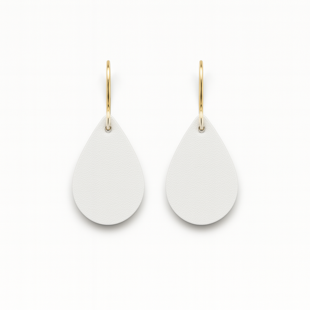 A pair of white leather teardrop earrings with gold-plated stainless steel hooks on a white background.